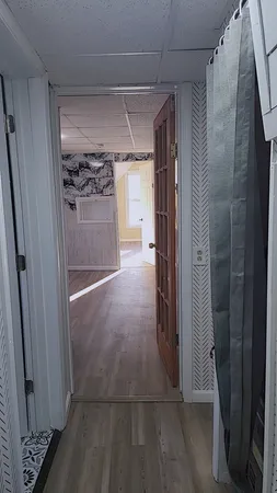 a view of entryway with wooden floor