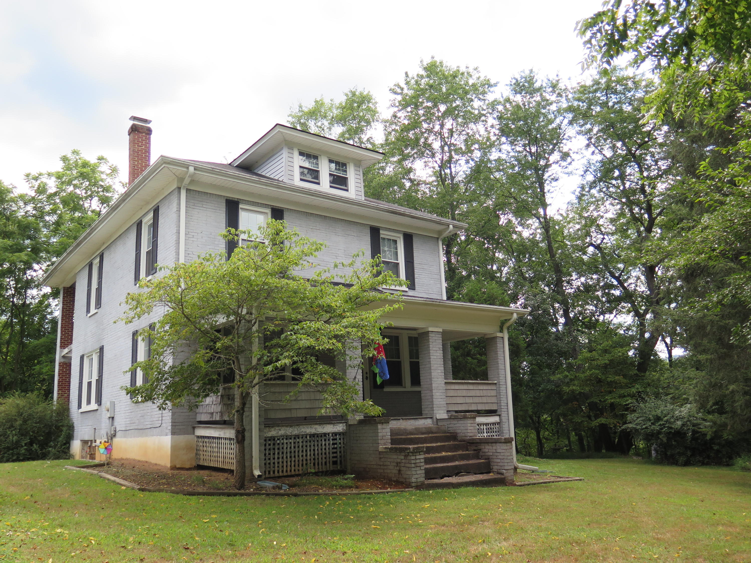 2315 Rutrough Road Southeast Roanoke, VA 24014 - Photo 1 of 38 a front view of house with yard and trees