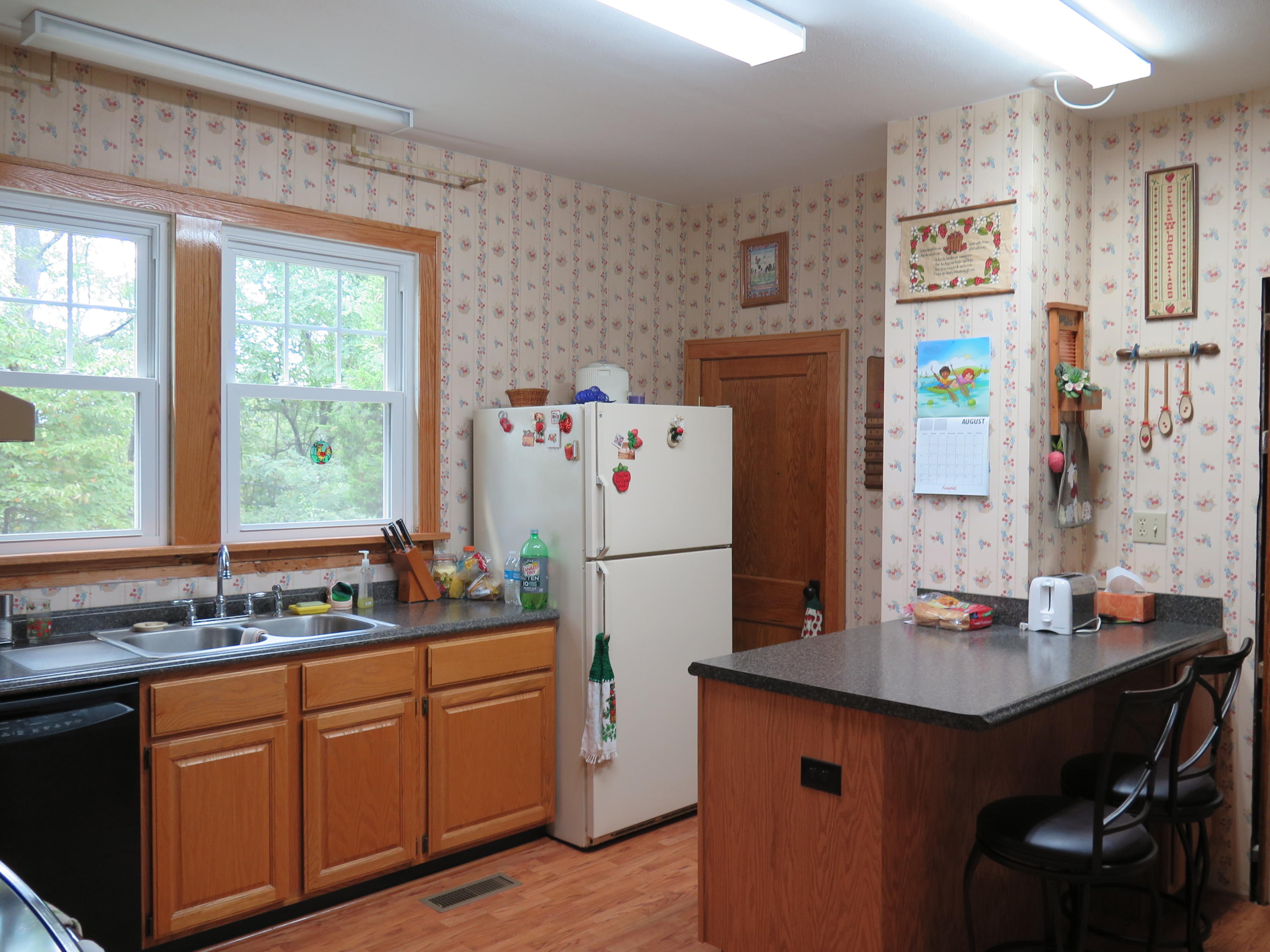 2315 Rutrough Road Southeast Roanoke, VA 24014 - Photo 2 of 38 a kitchen with stainless steel appliances a sink a refrigerator and a stove
