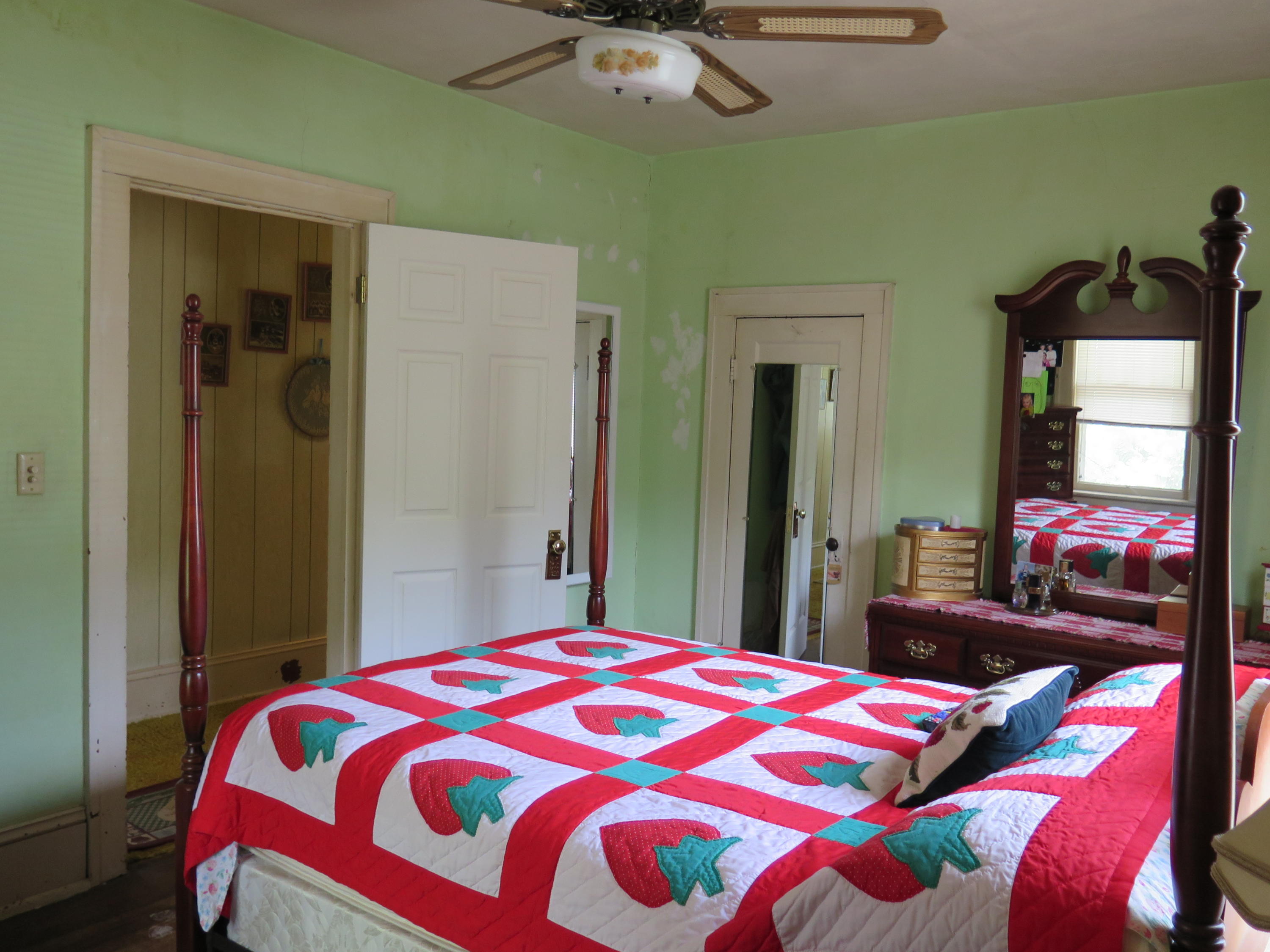 2315 Rutrough Road Southeast Roanoke, VA 24014 - Photo 16 of 38 a bedroom with a bed and a chandelier