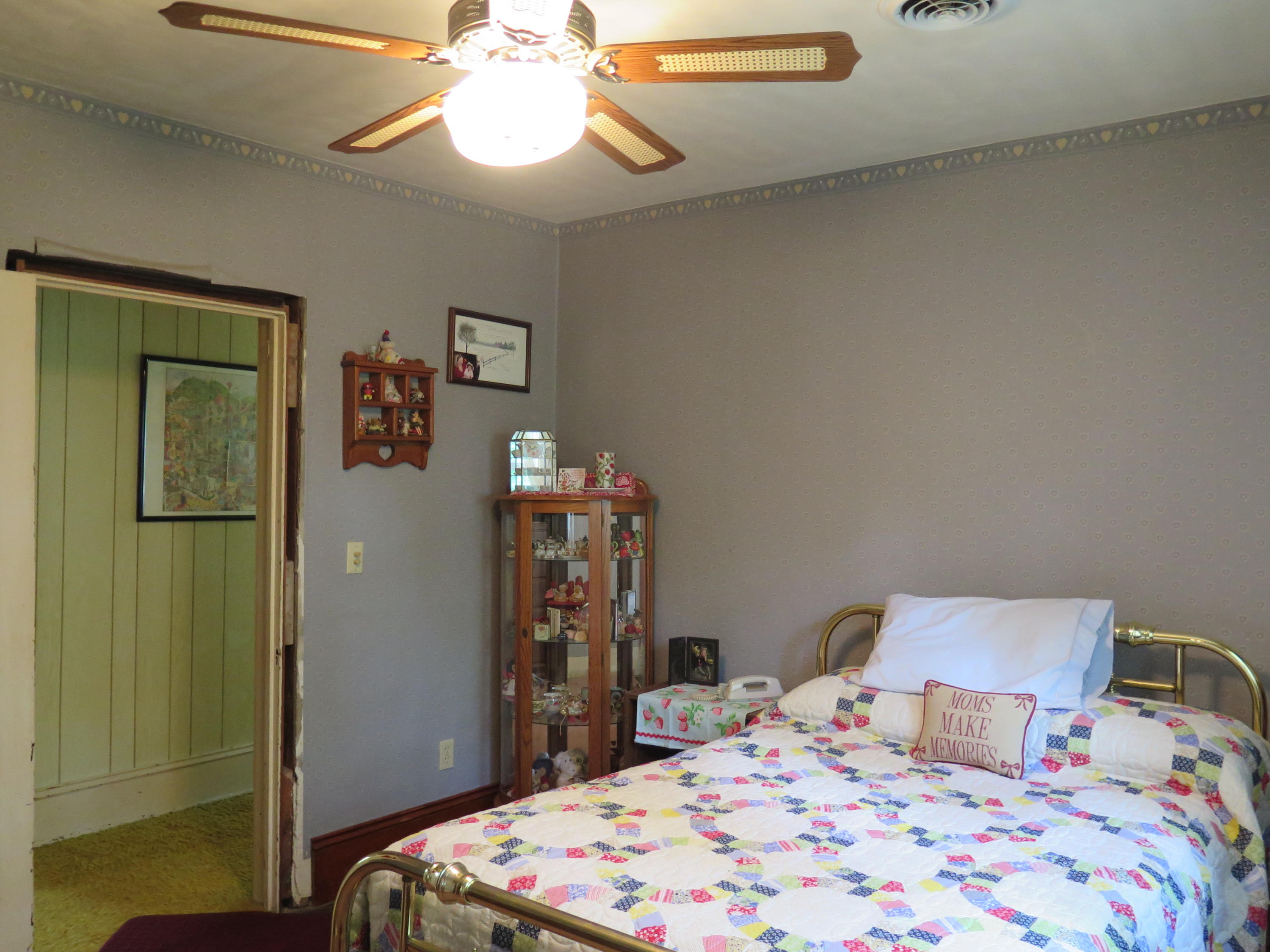 2315 Rutrough Road Southeast Roanoke, VA 24014 - Photo 19 of 38 a bedroom with a bed and a chandelier