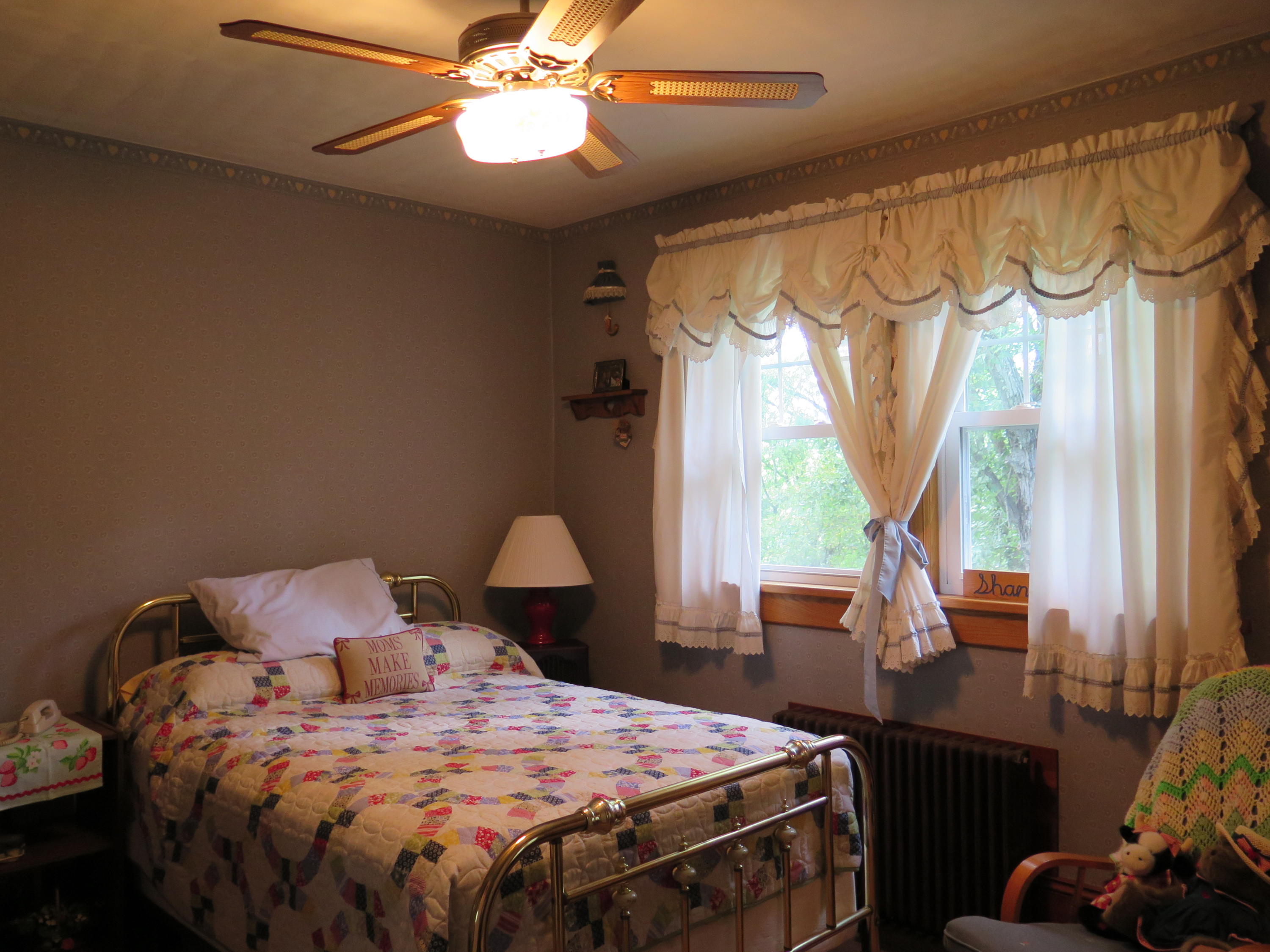 2315 Rutrough Road Southeast Roanoke, VA 24014 - Photo 20 of 38 a bedroom with a bed and a chandelier