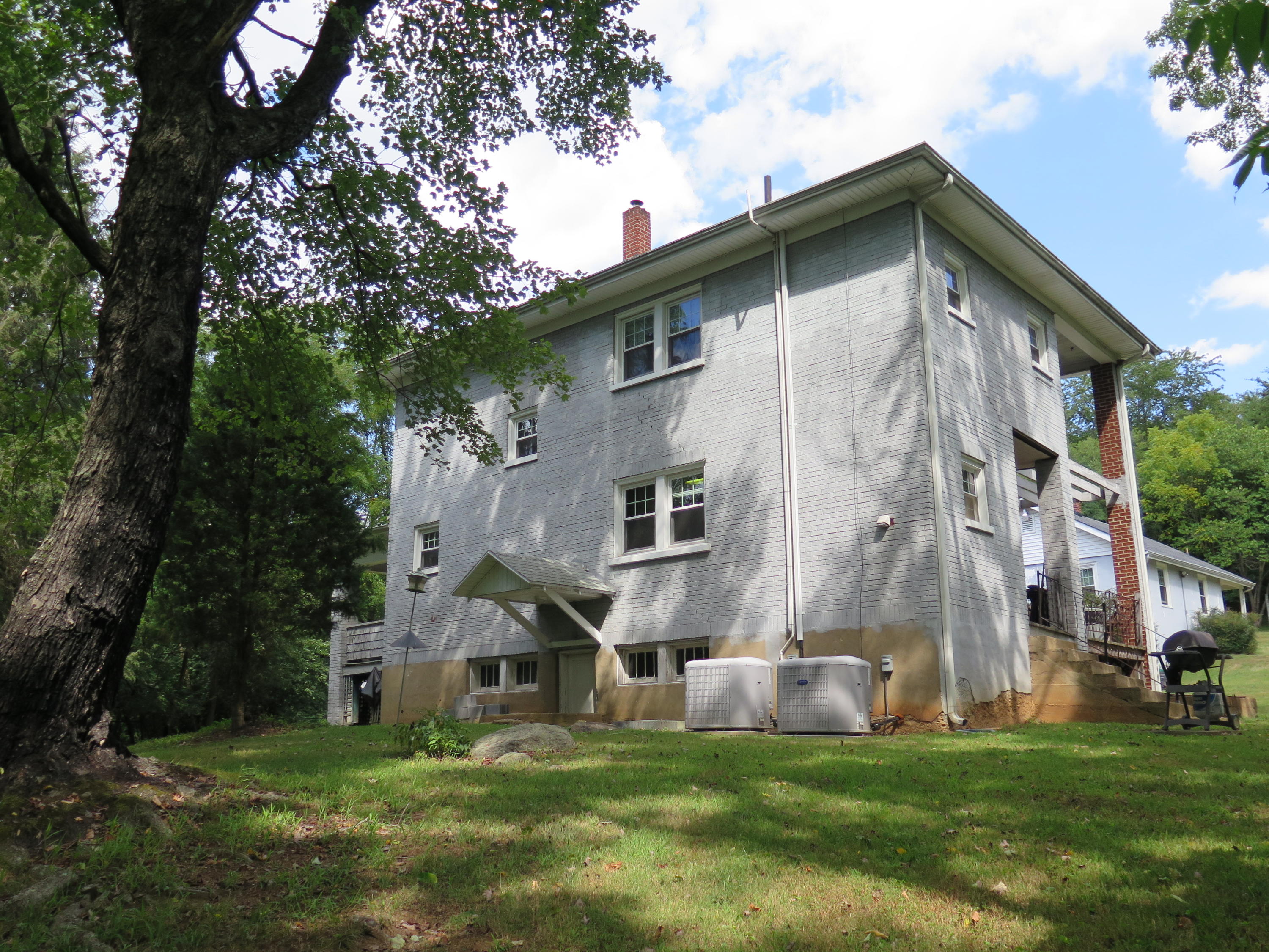 2315 Rutrough Road Southeast Roanoke, VA 24014 - Photo 25 of 38 a view of a big house with a big yard and large trees