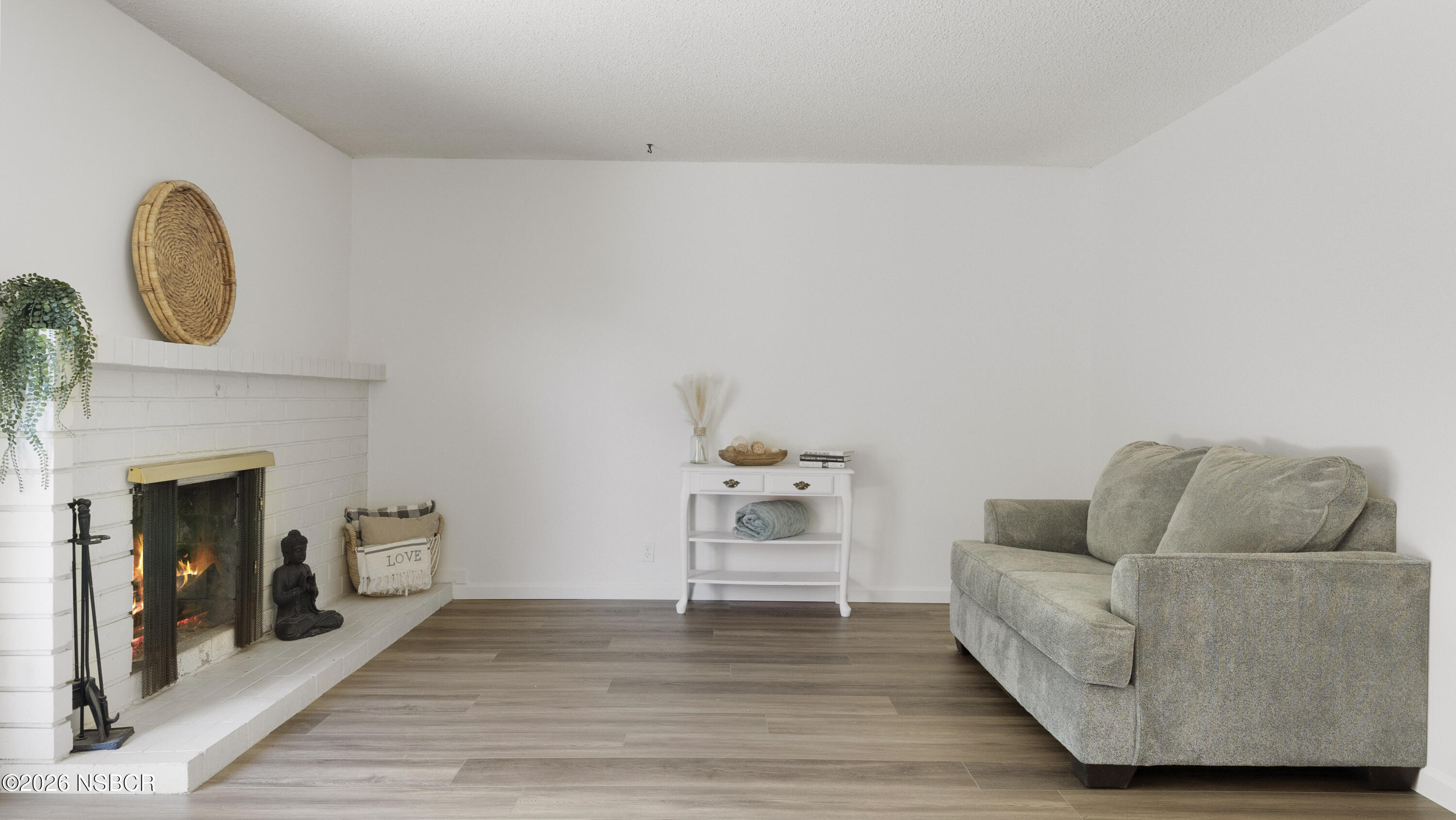 1312 North First Place Lompoc, CA 93436 - Photo 11 of 38 a living room with furniture and a fireplace