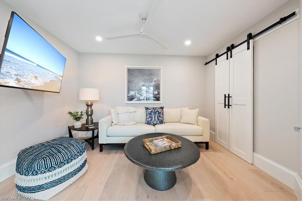 569 Park Shore Drive, Unit G5 Naples, FL 34103 - Photo 20 of 45 a living room with furniture and a rug