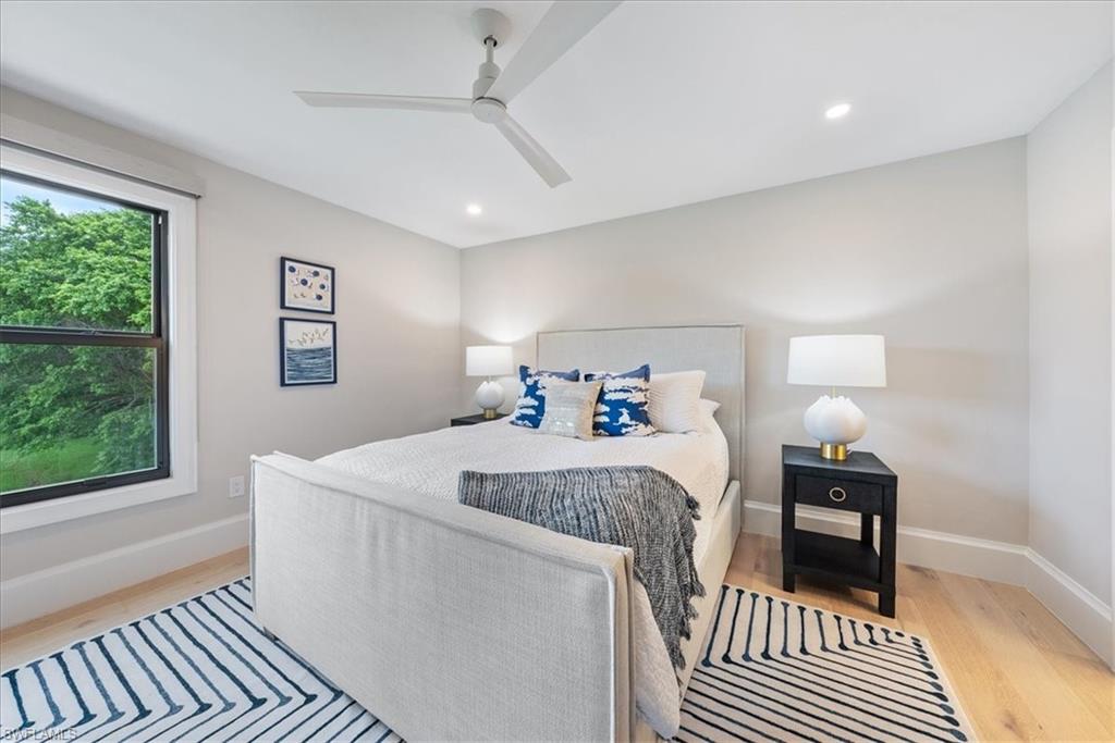 569 Park Shore Drive, Unit G5 Naples, FL 34103 - Photo 30 of 45 a bed room with a bed and a window
