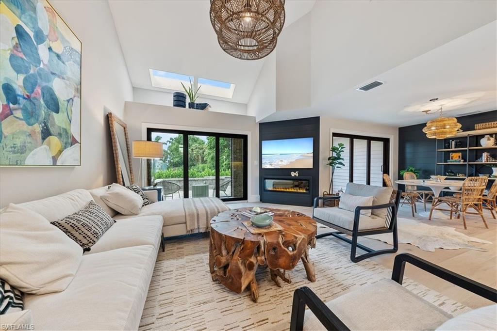 569 Park Shore Drive, Unit G5 Naples, FL 34103 - Photo 4 of 45 a living room with furniture and a large window