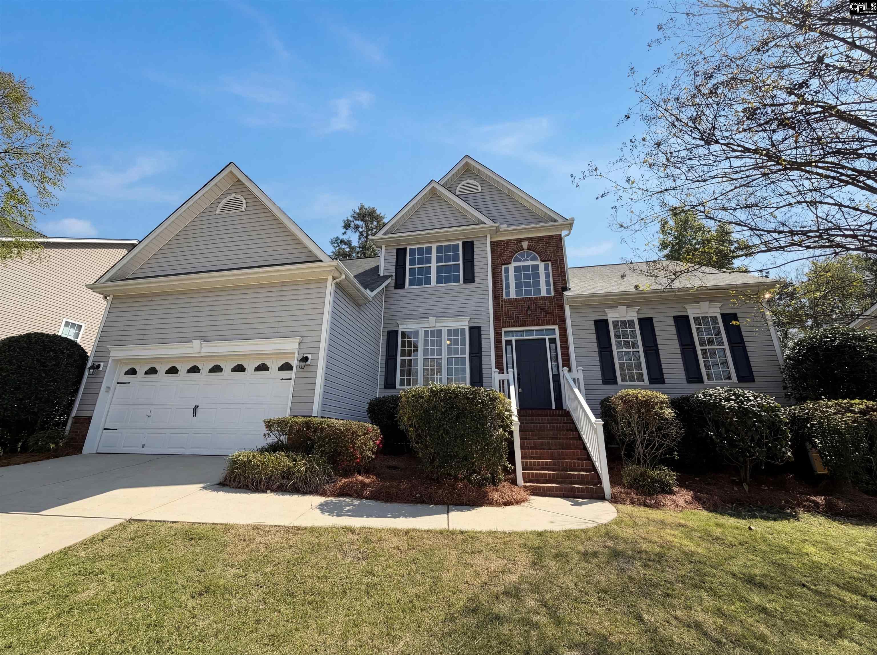 112 Coopers Hawk Circle Irmo, SC 29063 - Photo 9 of 26 a front view of a house with a yard and garage