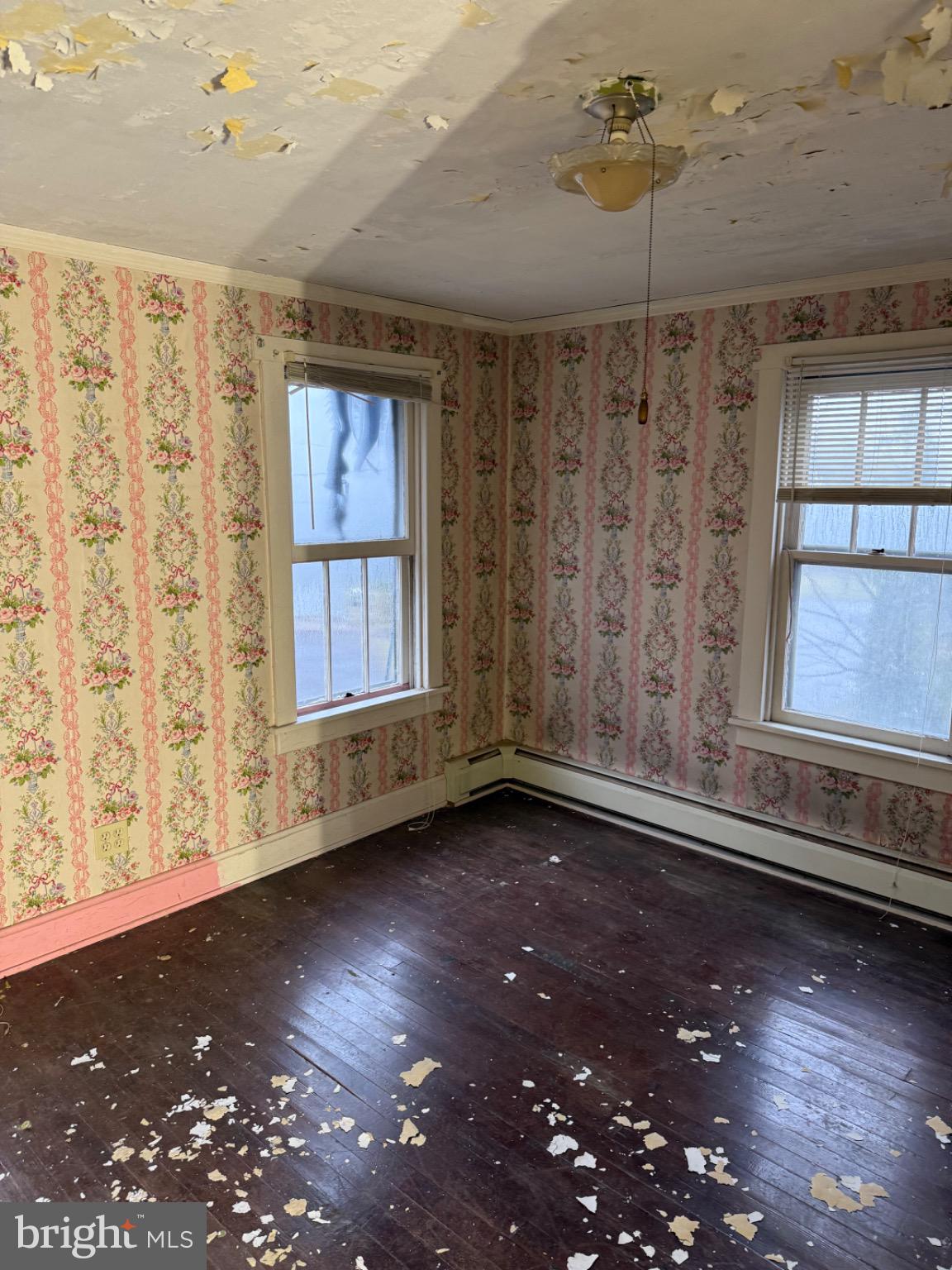 43 Main Street Tremont, PA 17981 - Photo 13 of 21 a view of an empty room with a window and wooden floor