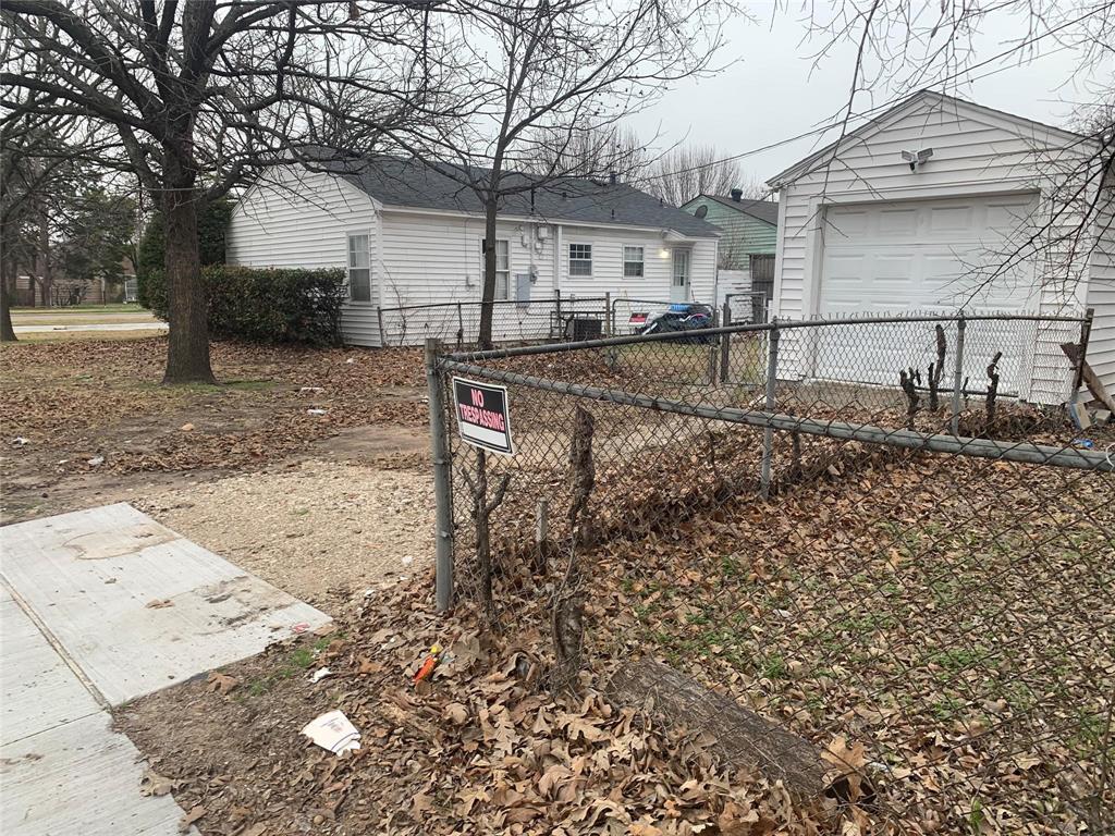 7419 Lake June Road Dallas, TX 75217 - Photo 2 of 2 a backyard of a house with lots of green space