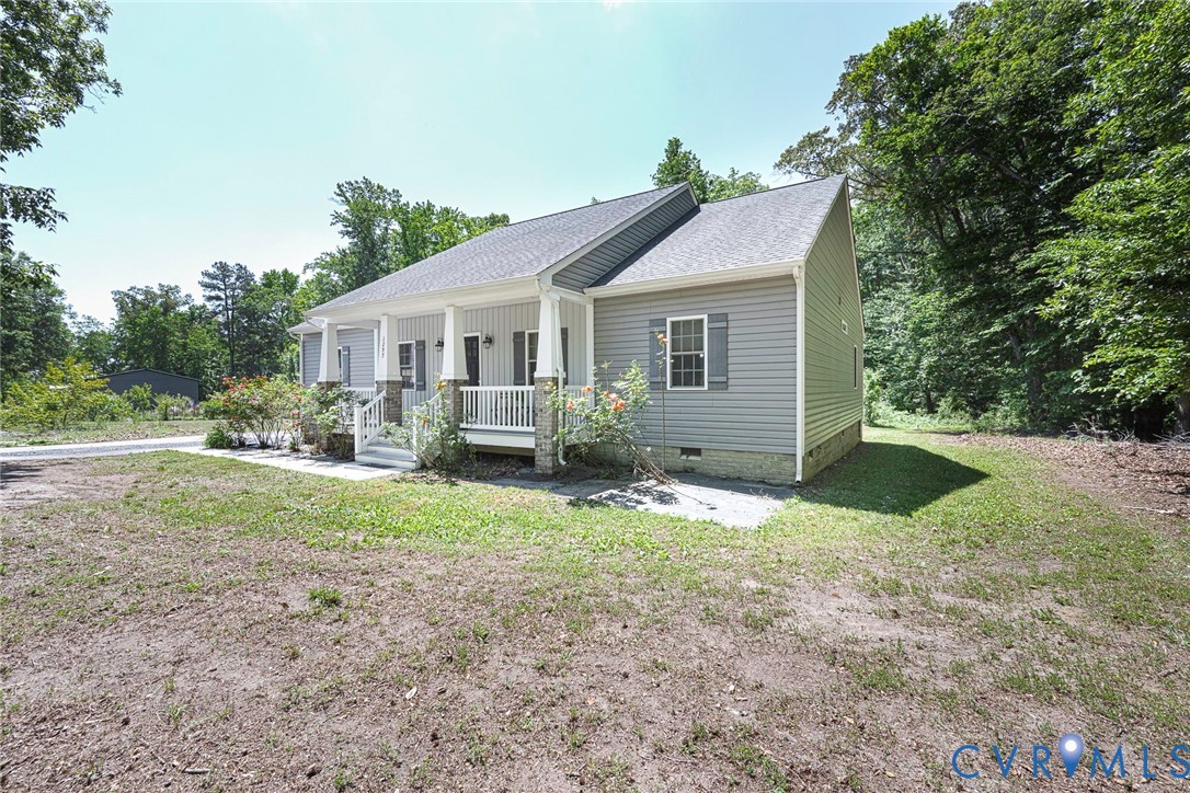 1297 Manfield Road Aylett, VA 23009 - Photo 17 of 41 a view of backyard of house with green space
