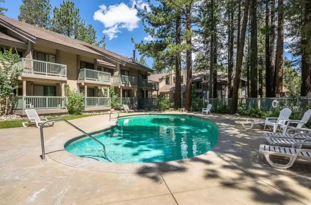 a view of a house with backyard porch and sitting area