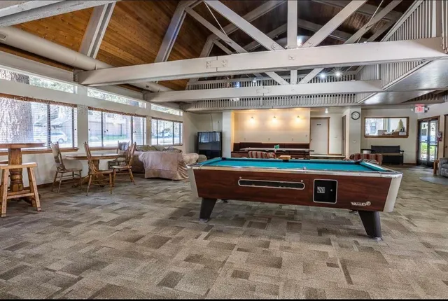 a room with lots of furniture and a projector