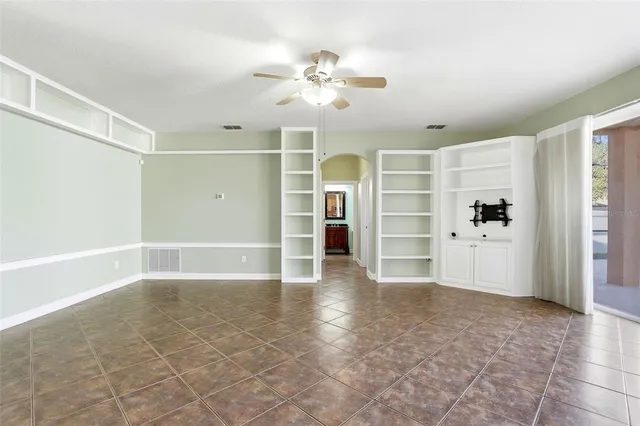 a kitchen with stainless steel appliances granite countertop a sink stove refrigerator and cabinets