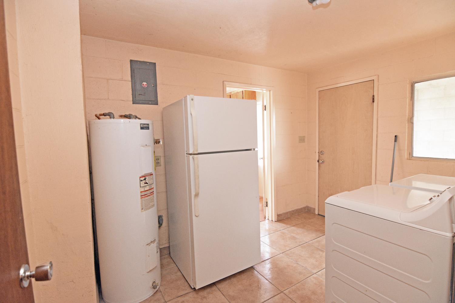 1206 South Verduga Road Turlock, CA 95380 - Photo 26 of 36 a white refrigerator freezer sitting in a kitchen