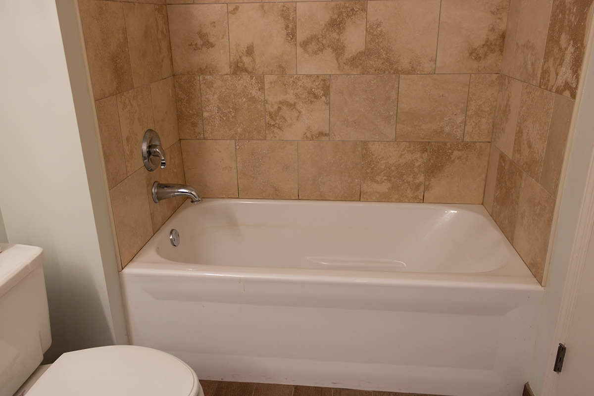 111 South Morgan Street, Unit 824 Chicago, IL 60607 - Photo 16 of 18 a white bath tub sitting next to a toilet