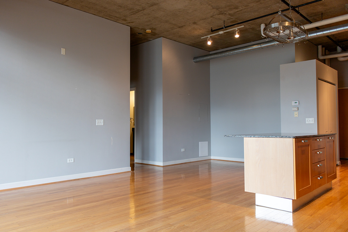 111 South Morgan Street, Unit 824 Chicago, IL 60607 - Photo 9 of 18 en empty room with wooden floor