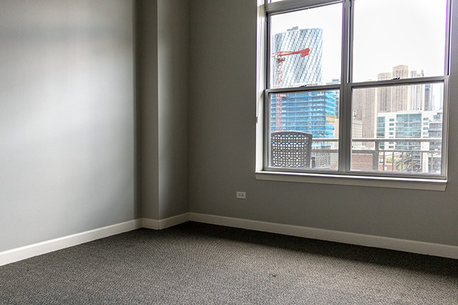111 South Morgan Street, Unit 824 Chicago, IL 60607 - Photo 10 of 18 an empty room with a window