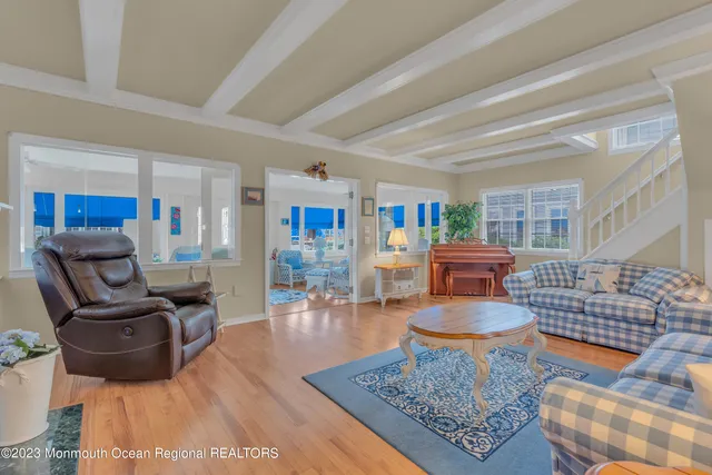 a living room with furniture and a rug