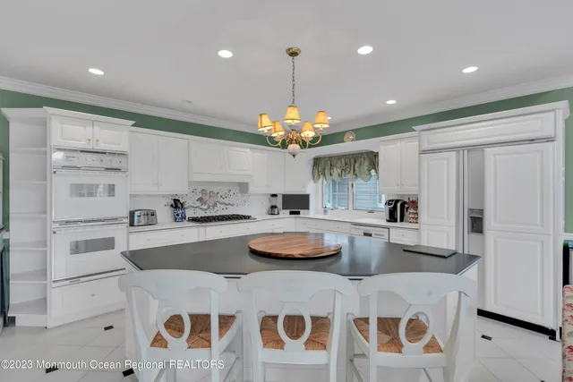 a kitchen with sink and cabinets