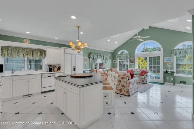 a living room with furniture ceiling fan and a rug
