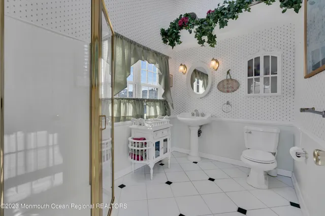a view of a hallway with wooden floor and closet