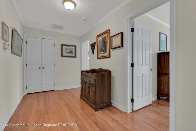 a bedroom with a bed couch and a window