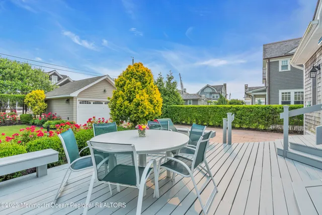 a view of yard with swimming pool and green space