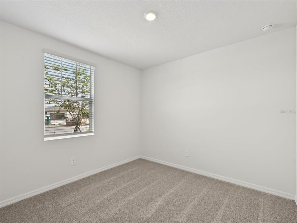 7628 Satterfield Terrace Parrish, FL 34219 - Photo 12 of 25 an empty room with a window