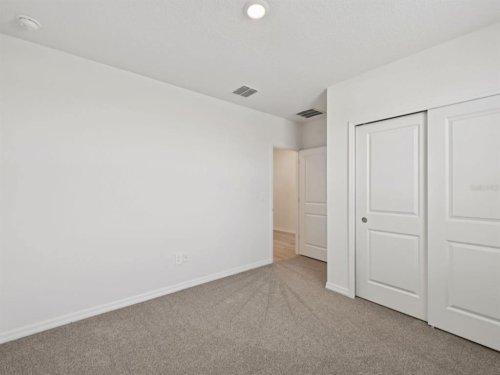 7628 Satterfield Terrace Parrish, FL 34219 - Photo 14 of 25 a view of an empty room