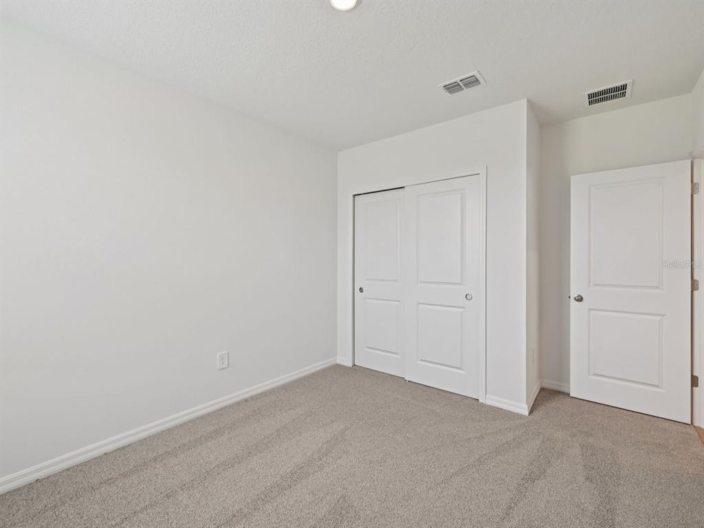7628 Satterfield Terrace Parrish, FL 34219 - Photo 17 of 25 a view of an empty room