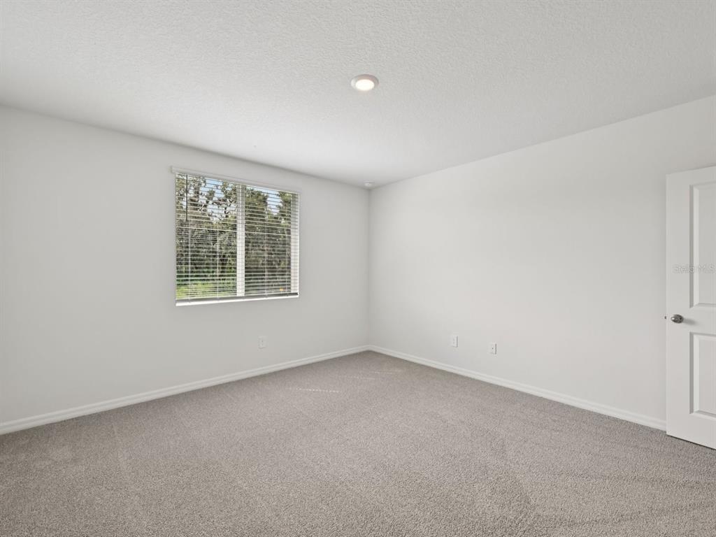 7628 Satterfield Terrace Parrish, FL 34219 - Photo 25 of 25 an empty room with windows
