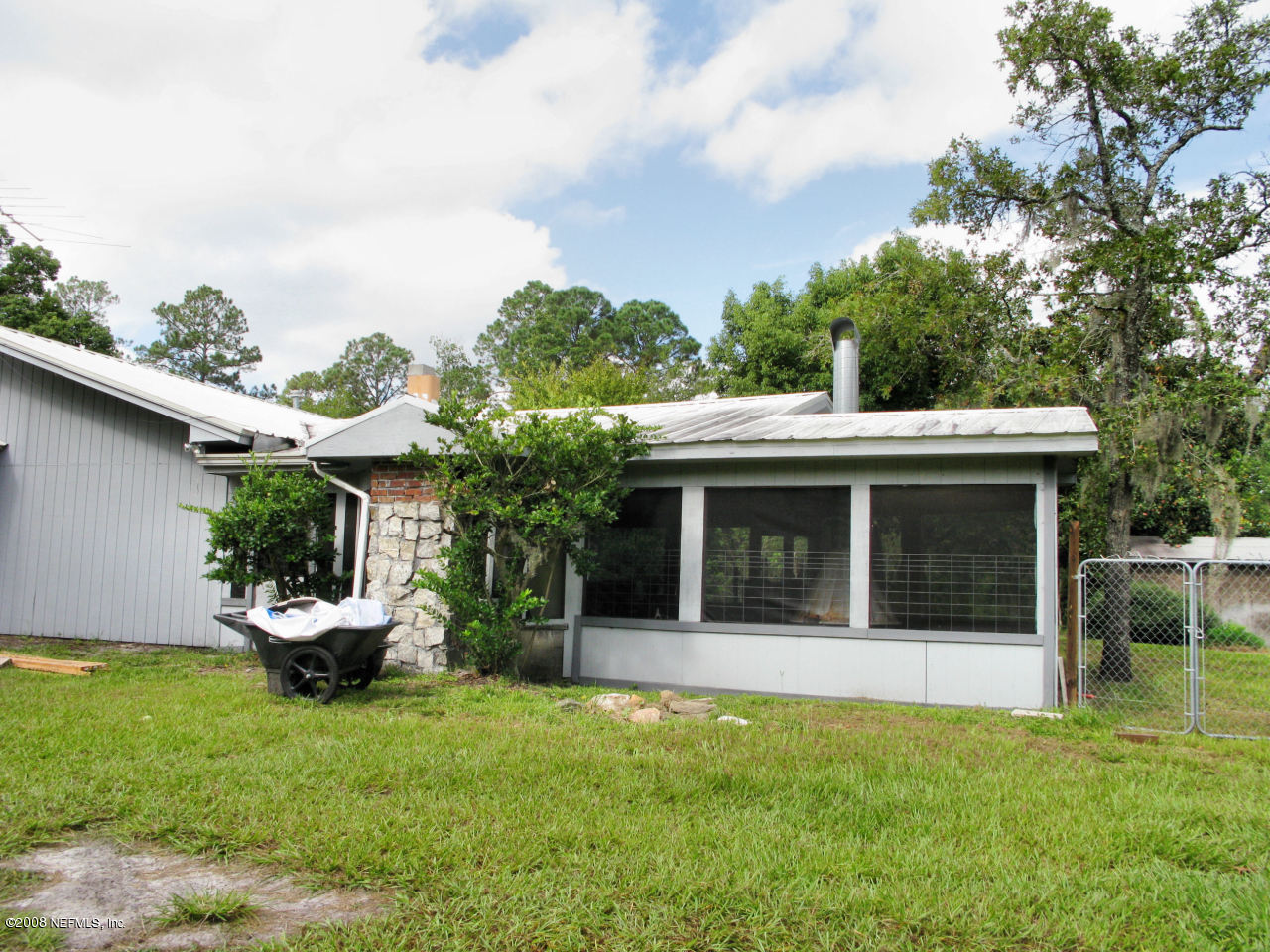 4026 Mustang Road Middleburg, FL 32068 - Photo 29 of 32 a view of a house with backyard and sitting area