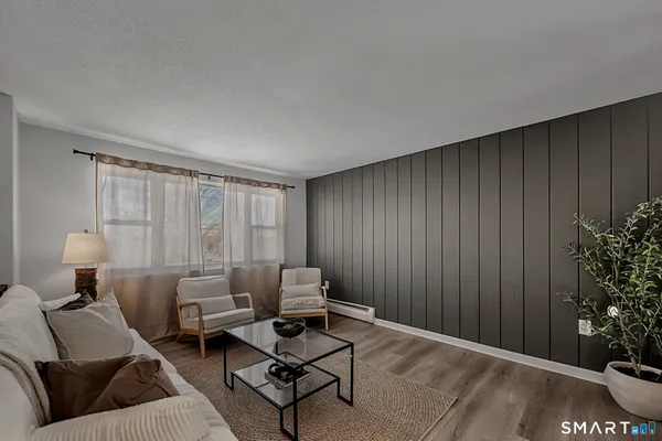 a kitchen with stainless steel appliances a stove a sink and cabinets