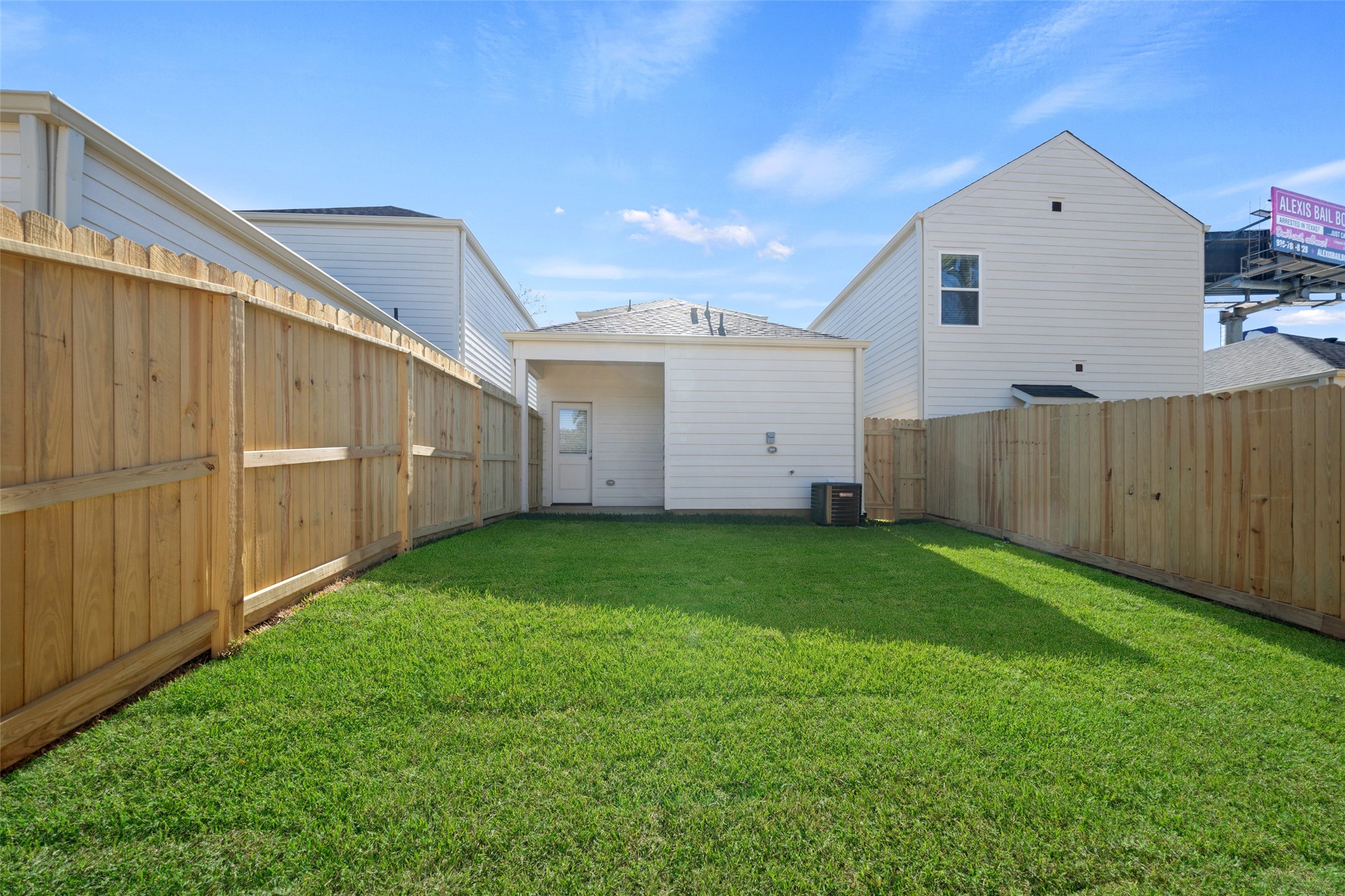716 West Dallas Street Conroe, TX 77301 - Photo 23 of 24 a view of a backyard with garage