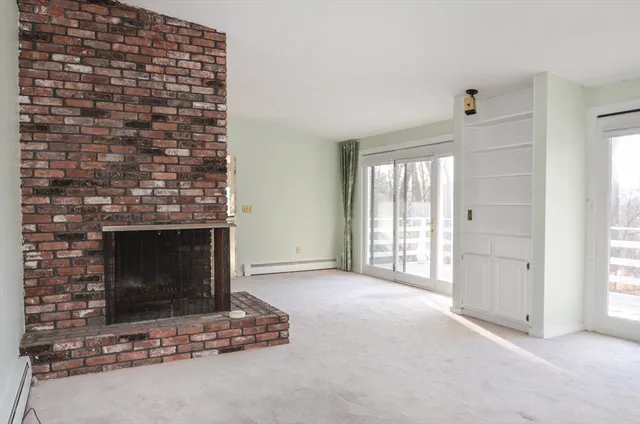 a living room with a fireplace