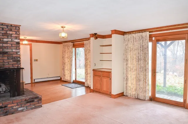 a view of a room with large windows