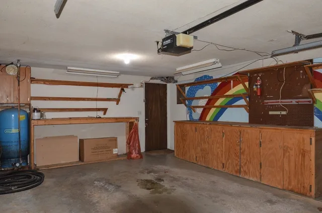 a view of an empty room with a fireplace