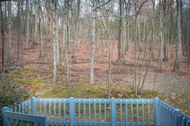 a view of a balcony with wooden fence