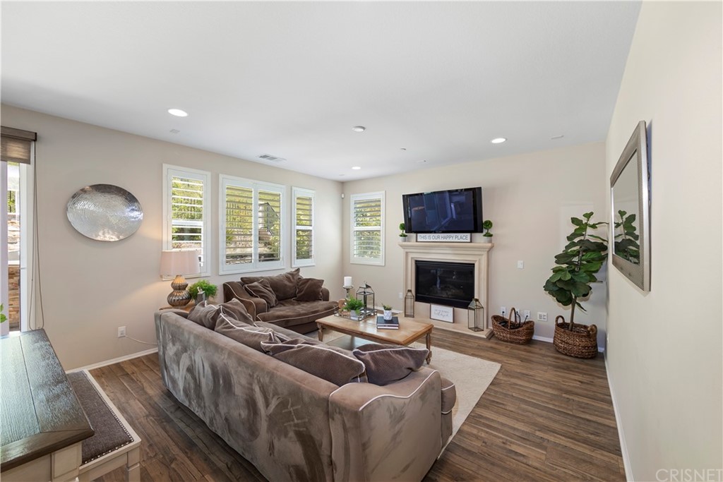 28504 Farrier Drive Valencia, CA 91354 - Photo 13 of 45 a living room with furniture potted plant and a fireplace