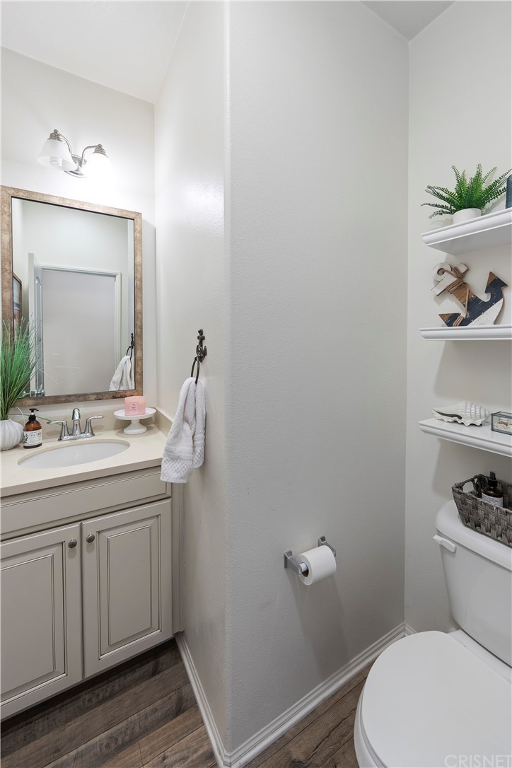 28504 Farrier Drive Valencia, CA 91354 - Photo 17 of 45 a bathroom with a toilet a sink and mirror
