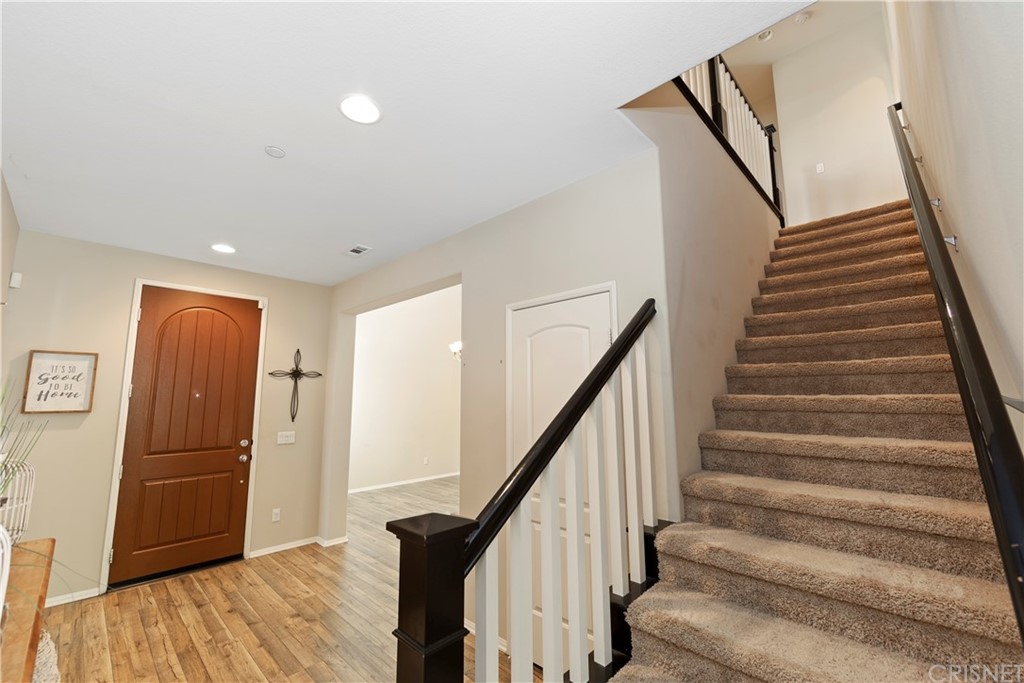 28504 Farrier Drive Valencia, CA 91354 - Photo 20 of 45 a view of entryway with wooden floor and stairs