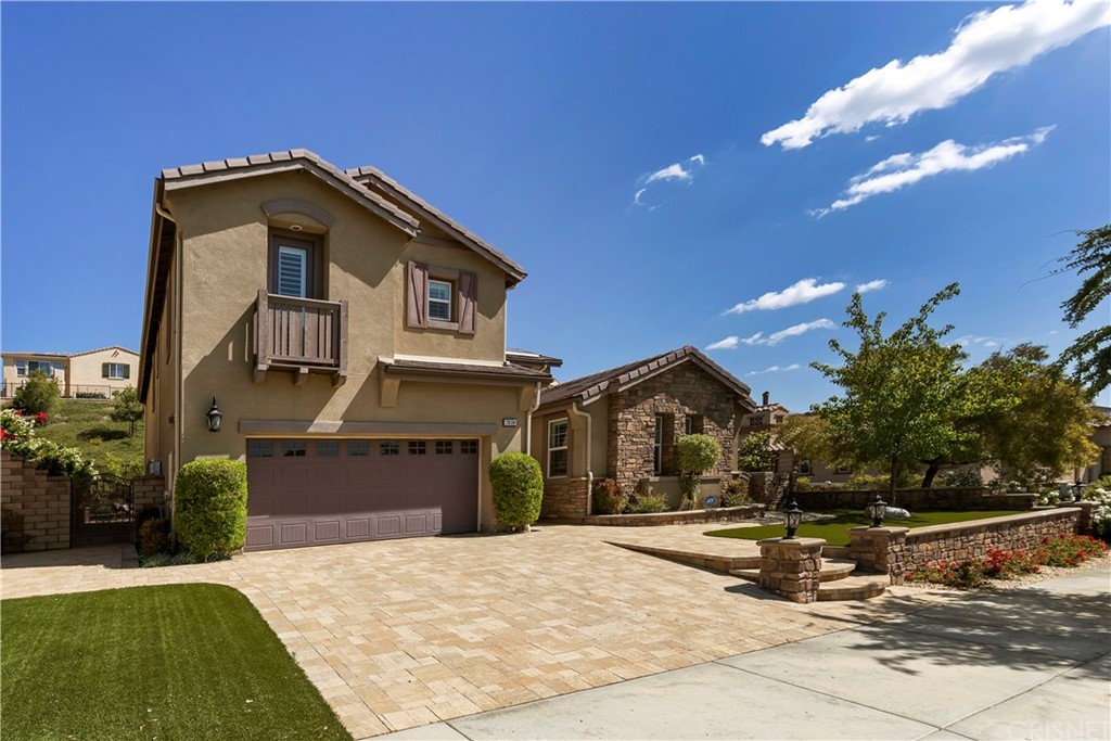 28504 Farrier Drive Valencia, CA 91354 - Photo 2 of 45 a front view of a house with a yard