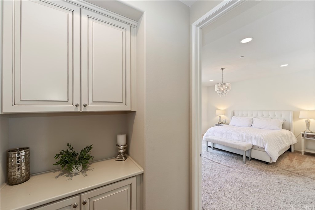 28504 Farrier Drive Valencia, CA 91354 - Photo 21 of 45 a en suite bathroom with a granite countertop sink and a mirror