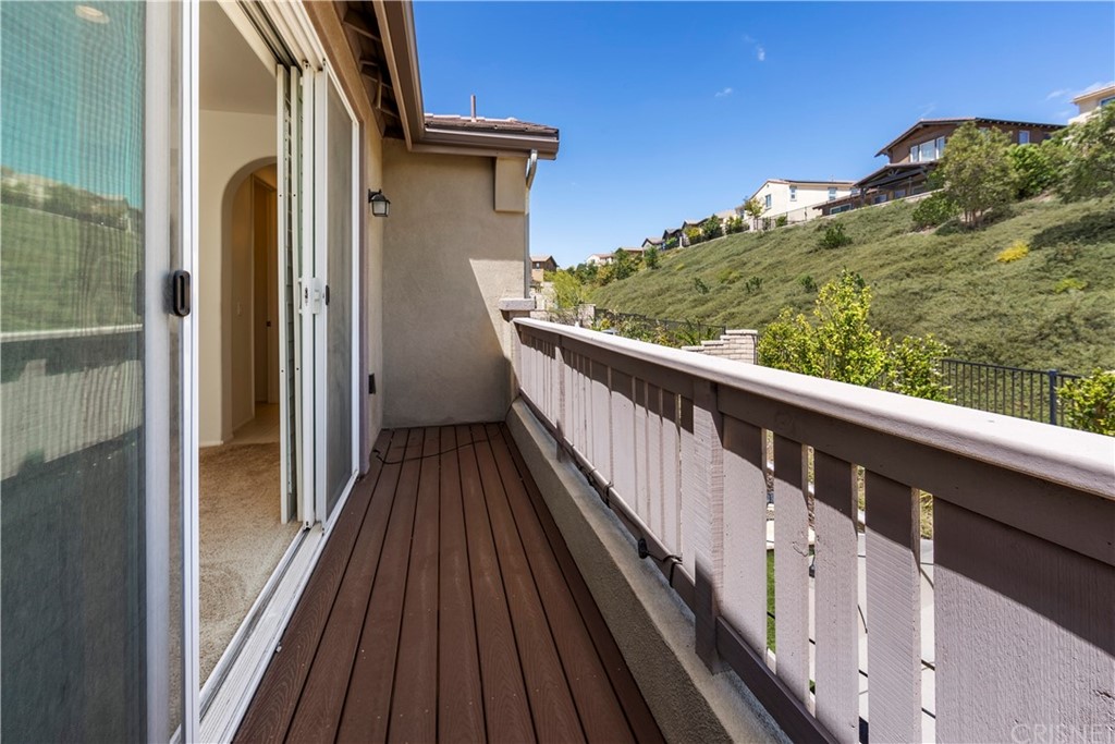 28504 Farrier Drive Valencia, CA 91354 - Photo 24 of 45 a view of a balcony with wooden floor and fence