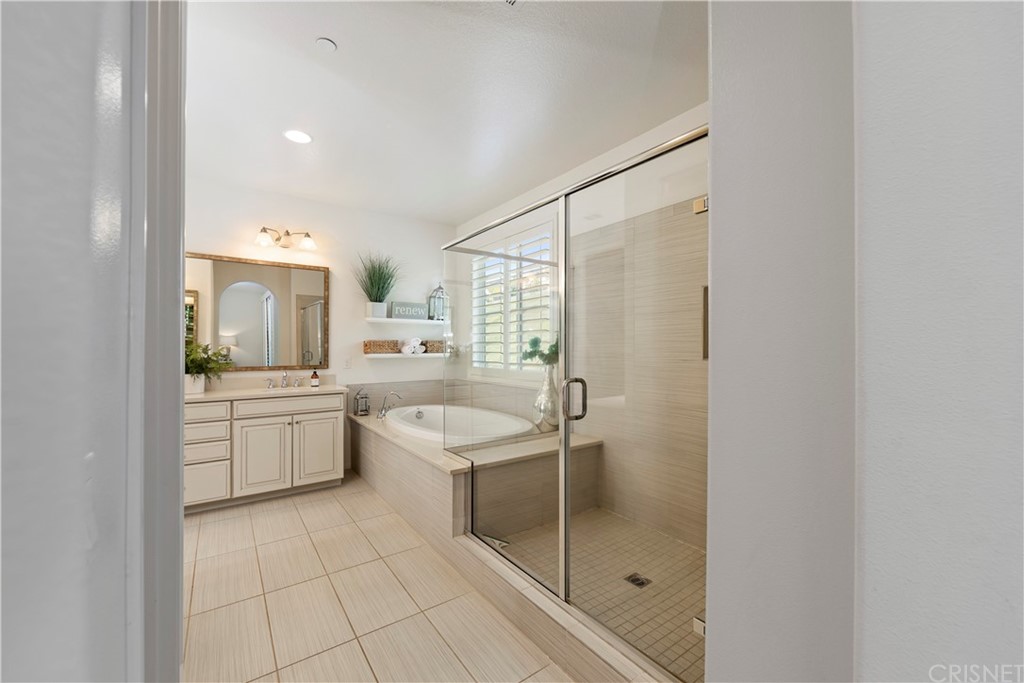 28504 Farrier Drive Valencia, CA 91354 - Photo 25 of 45 a bathroom with a granite countertop sink mirror and double