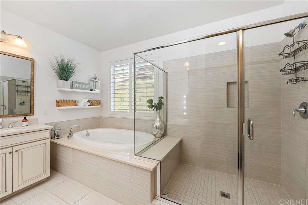 28504 Farrier Drive Valencia, CA 91354 - Photo 26 of 45 a bathroom with a granite countertop sink a toilet and shower
