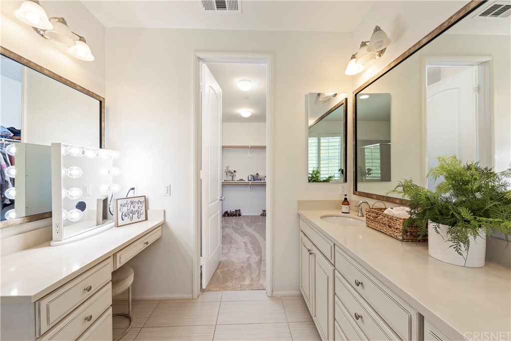 28504 Farrier Drive Valencia, CA 91354 - Photo 27 of 45 a spacious bathroom with a double vanity sink a large mirror and a shower
