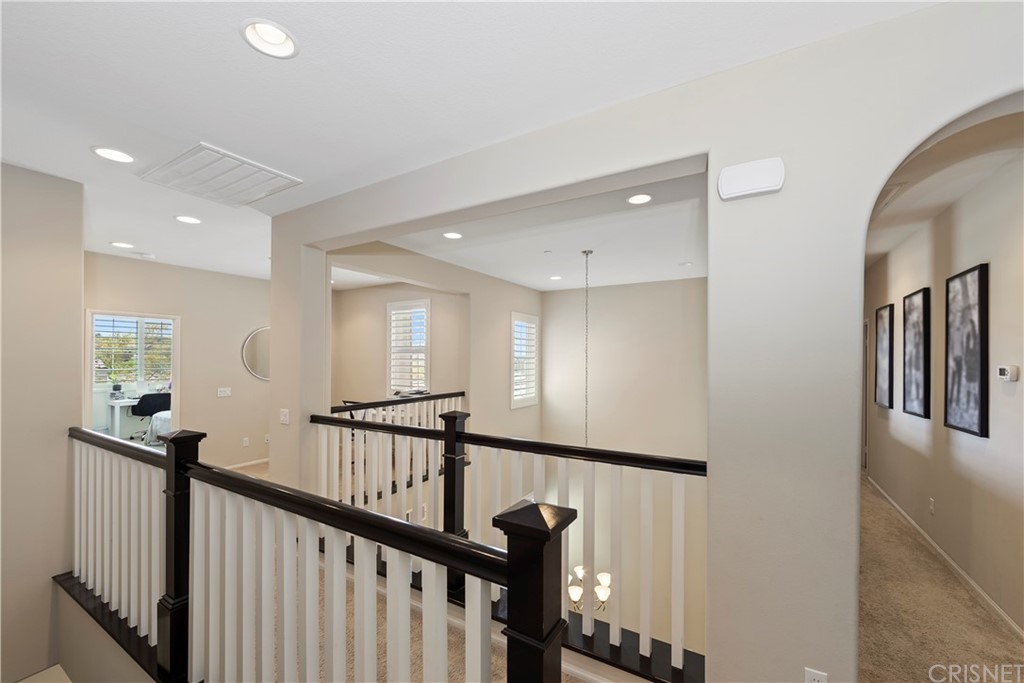 28504 Farrier Drive Valencia, CA 91354 - Photo 29 of 45 a view of a hallway with windows