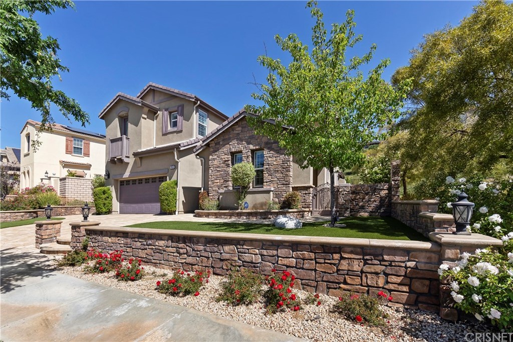 28504 Farrier Drive Valencia, CA 91354 - Photo 3 of 45 a front view of a house with a yard